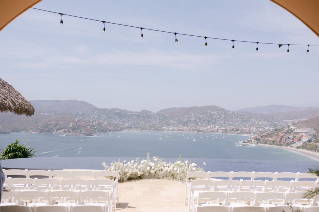 Chairs and flowers where McKenna and Robert's destination wedding will be held in Zihuatanejo, Mexico