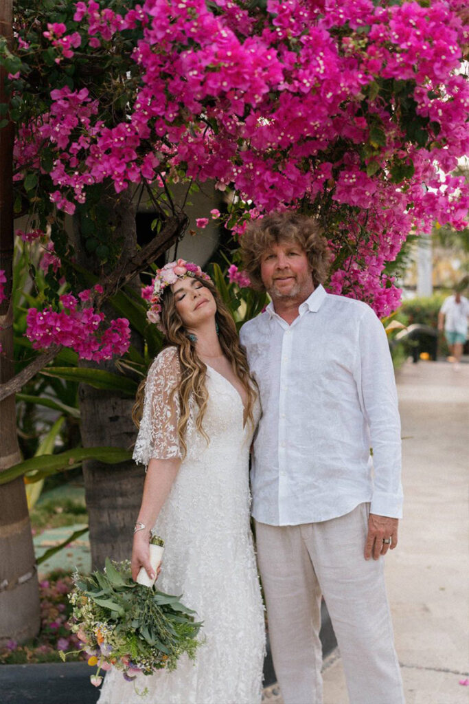 Bride and groom embrace during their wedding in Zihuatanejo, Mexico.